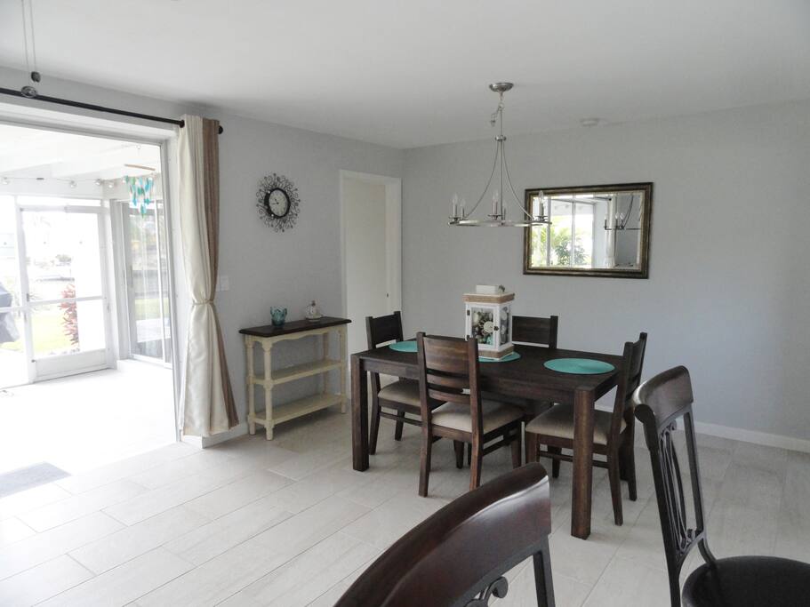 Dining area with view out to lanai and canal.