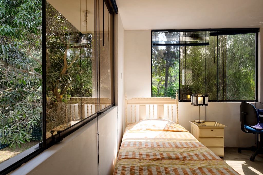 Lots of natural light. Bedroom with working desk, closet, big chest and full bathroom