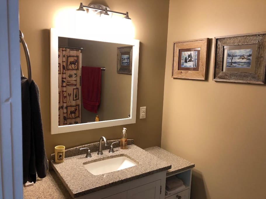 Bathroom with shower/tub combo and new towels