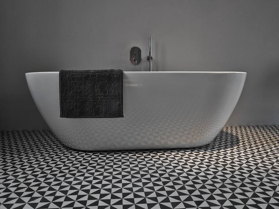 the highlight of the flat. Isolated bathtub.