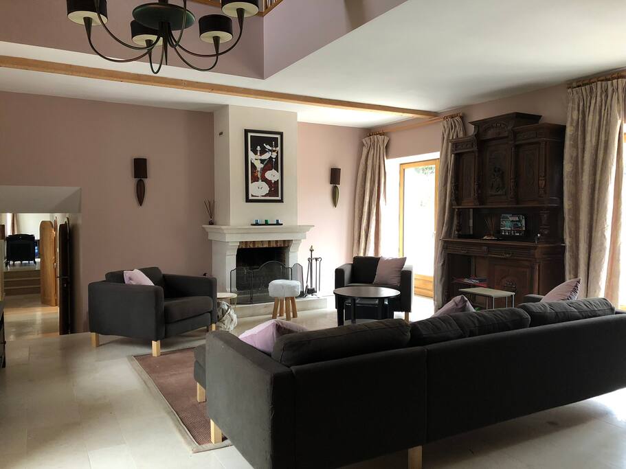 Beautifully decorated living room with open fireplace for those colder evenings. Open to the rafters, with mezzanine area above for reading and lounging in front of upstairs TV (with PlayStation)