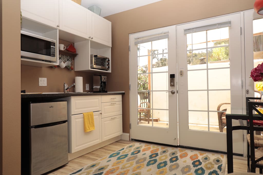 Kitchenette includes microwave, toaster oven, small refrig, coffee maker, bean grinder. Completely furnished with dishes.