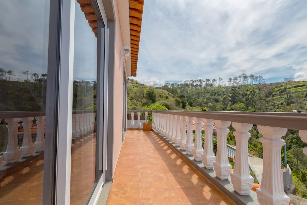 A balcony stretching the width of the house leading off the large lounge dining room. Accessed by two large french doors.