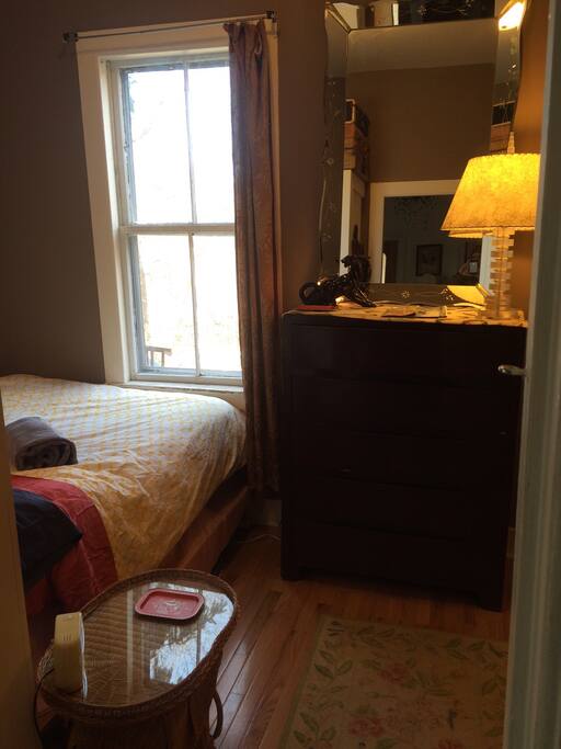Cozy bedroom with window to the garden.