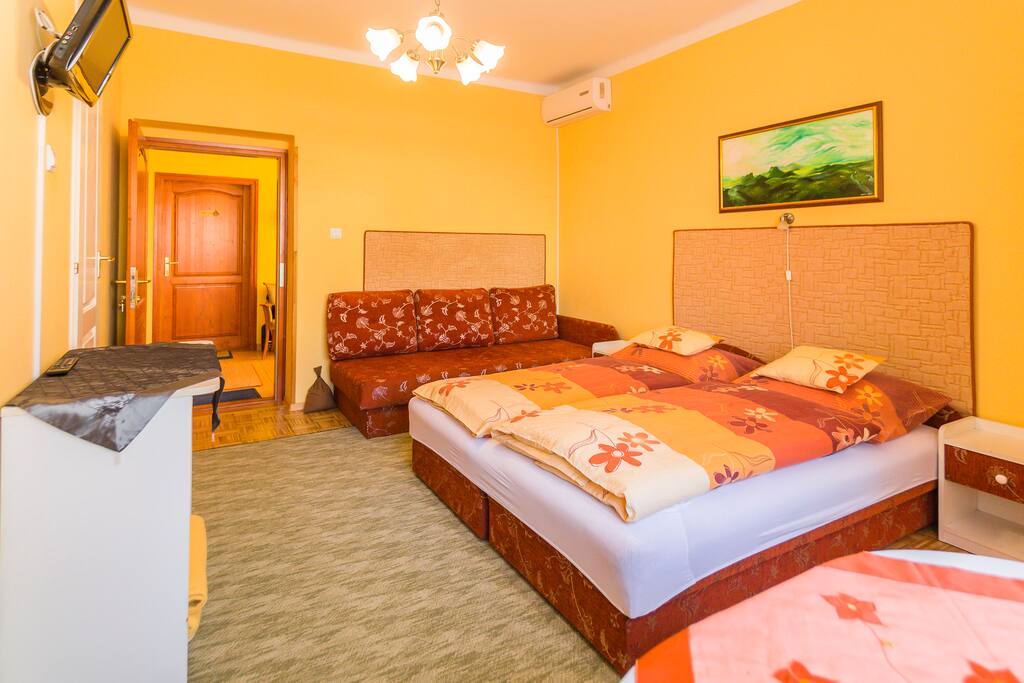 Bedroom with a double and a single bed