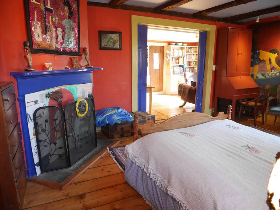 Private bedroom and library suite with pocket door divider.