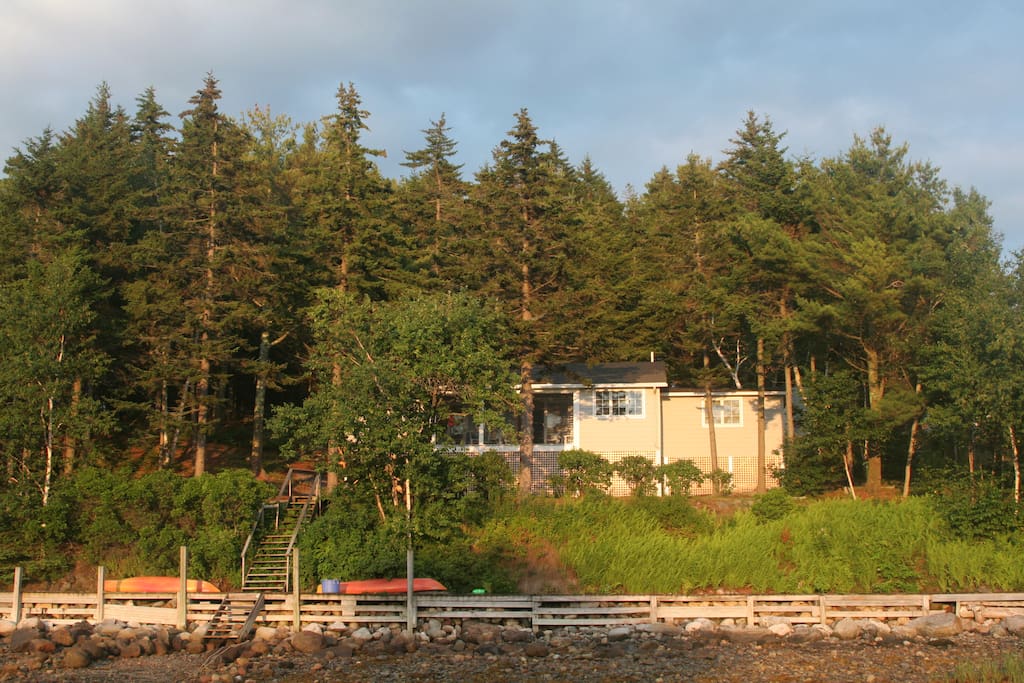 The view of the front of the cottage from the cove at low tide.