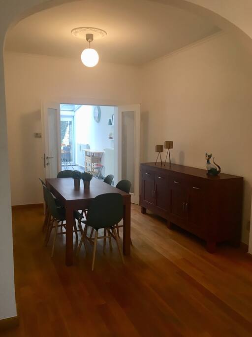 Spacious dinner table in a modern setting, enjoy your meal!