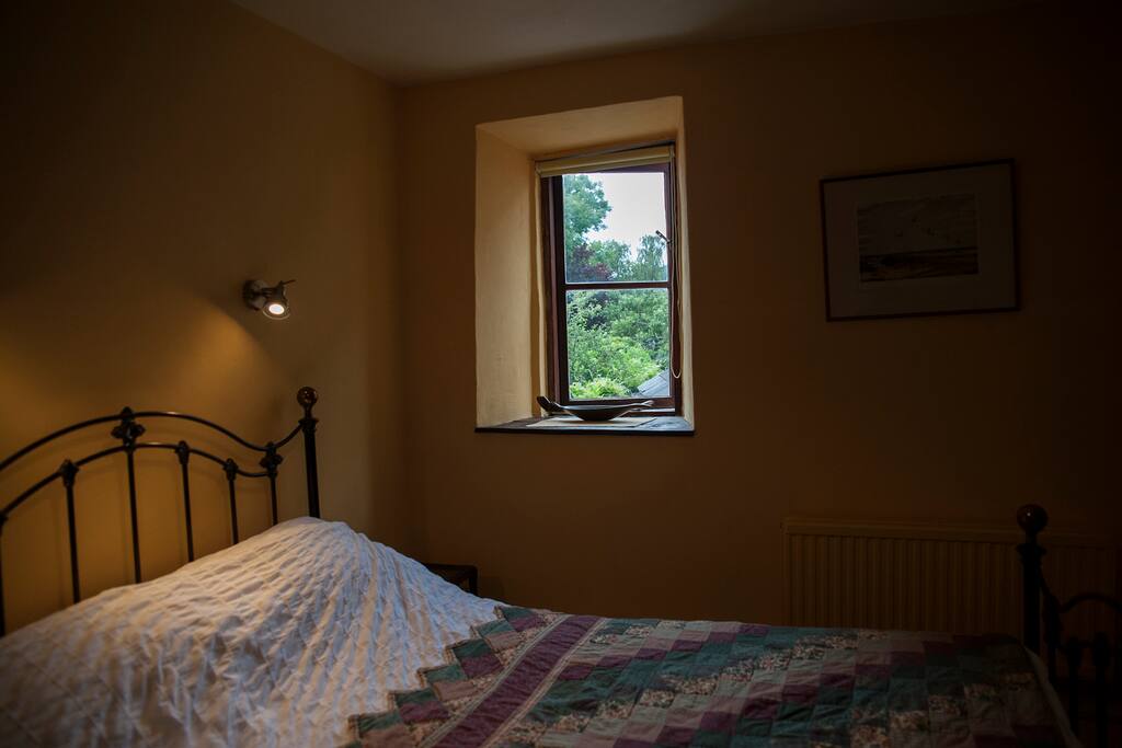 small en-suite bedroom with window to rear.