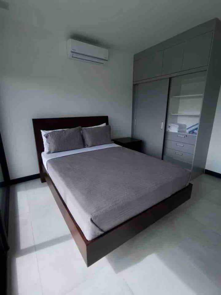 Room with a comfortable bed, A/C and closet