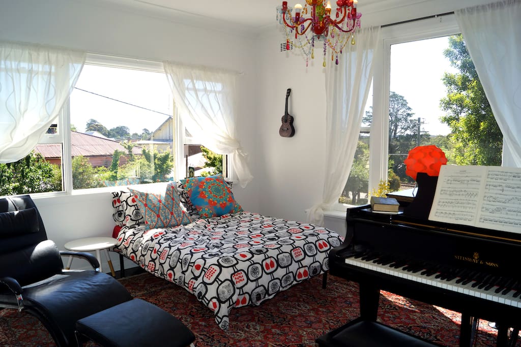 Airy front room with double bed, 2 built in heaters and piano