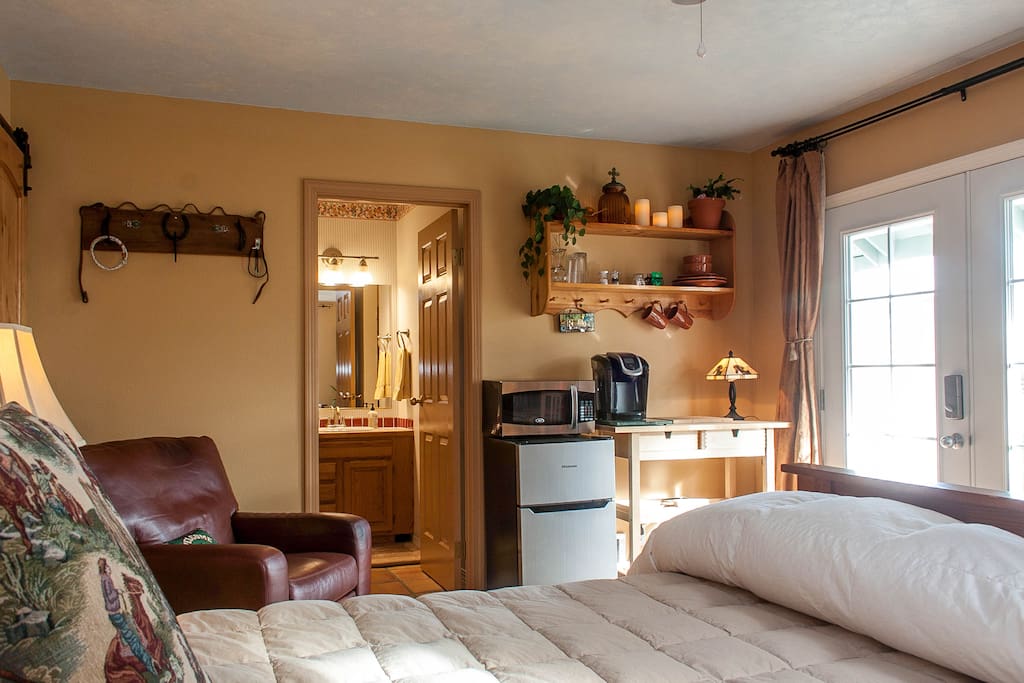 Large Guest Suite with private french door entrance, kitchenette, full bath, walk-in closet, cozy leather recliner