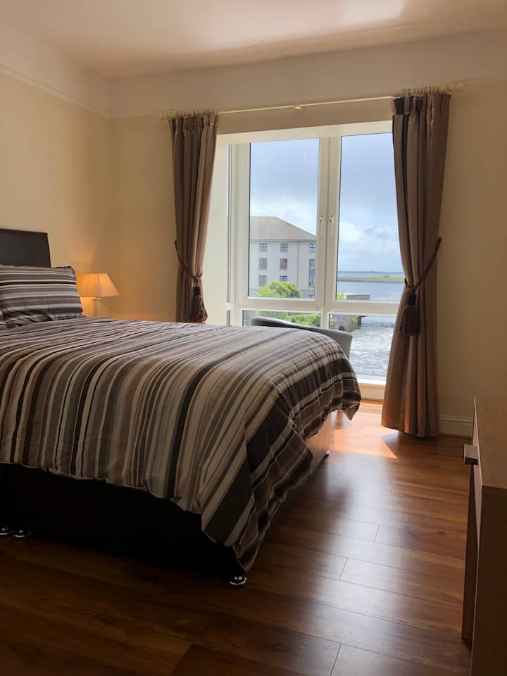 Main Bedroom has an ensuite Bathroom, and has a cosy Kingsize Bed as well as Fantastic Views of the River Corrib and of Galway Bay