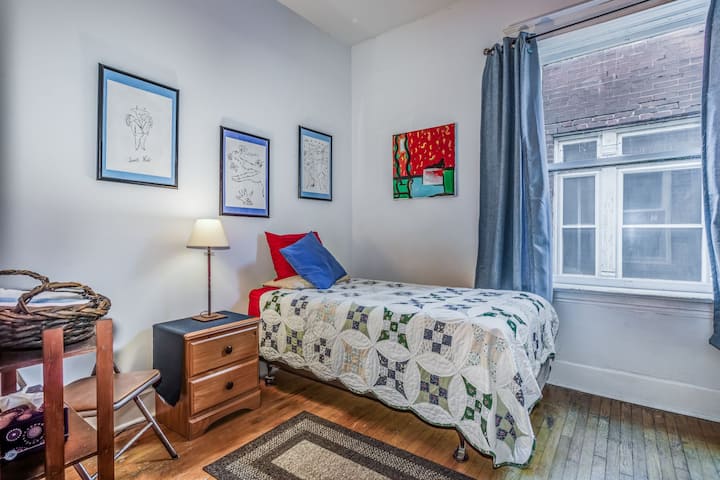 Middle bedroom. Single bed. Andy Warhol on the wall plus another original painting