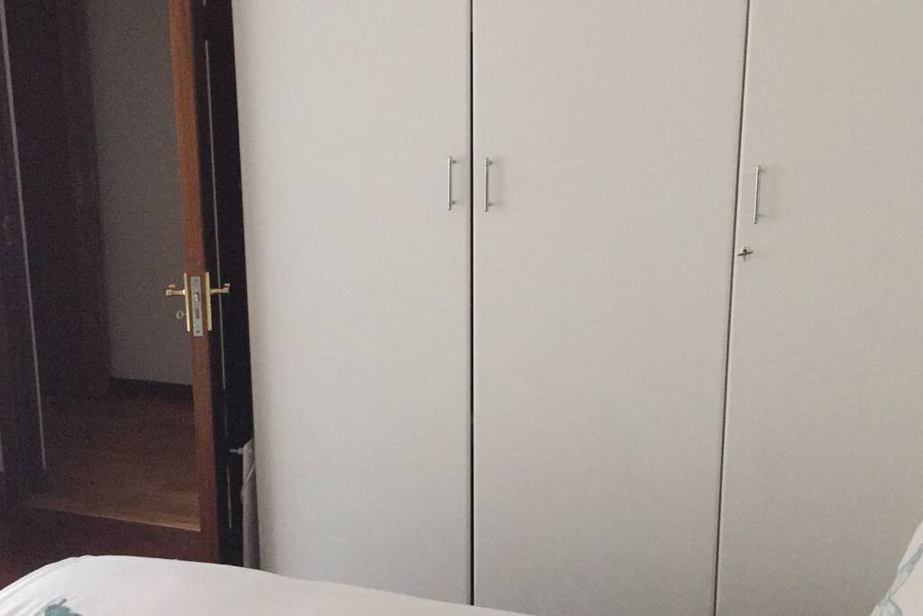 Very bright, luxury room, with queen size bed, side table with side lamp and lots of cupboard space.