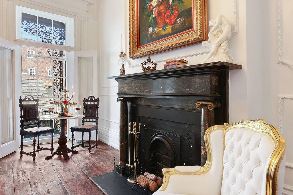 The original 1820s black shoreham marble fireplace is the central focus of this cozy and elegant suite