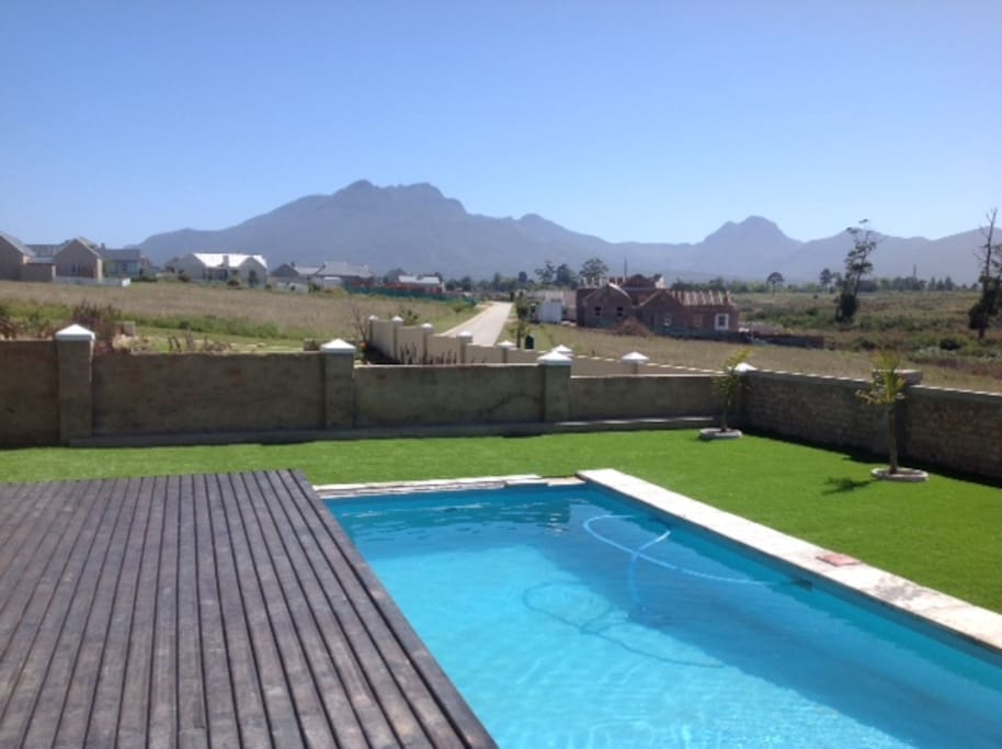 Swimming pool with sliding deck