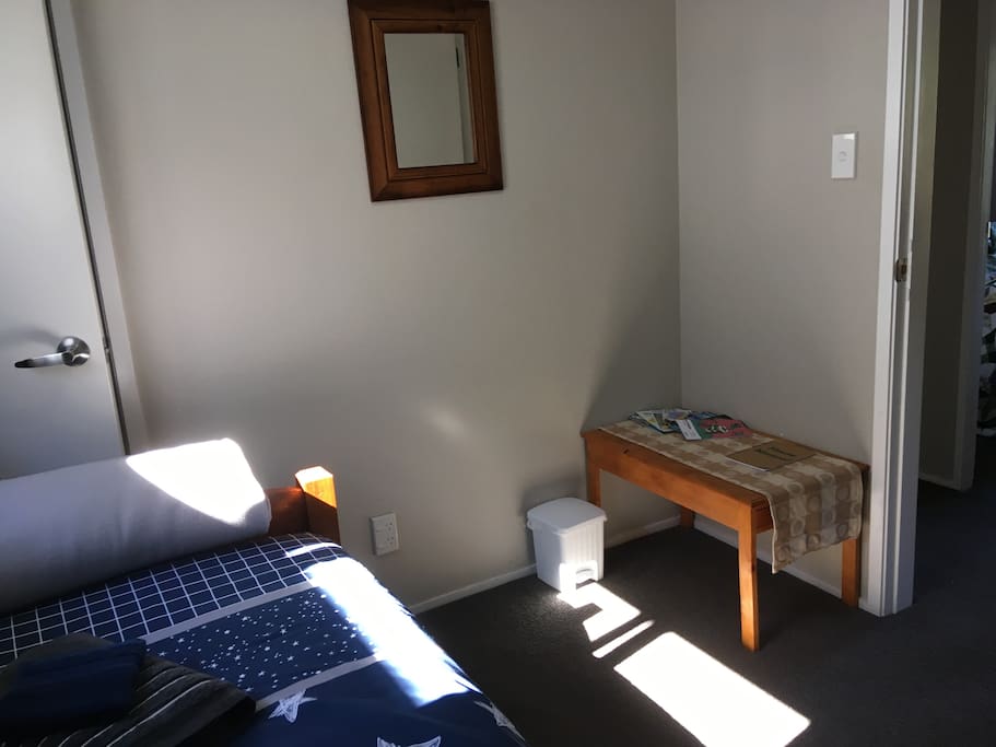 There’s extra blankets and a space to hang your clothes in the room’s small closet.