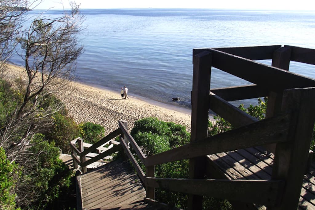 Beach access is by stairs from clifftop
