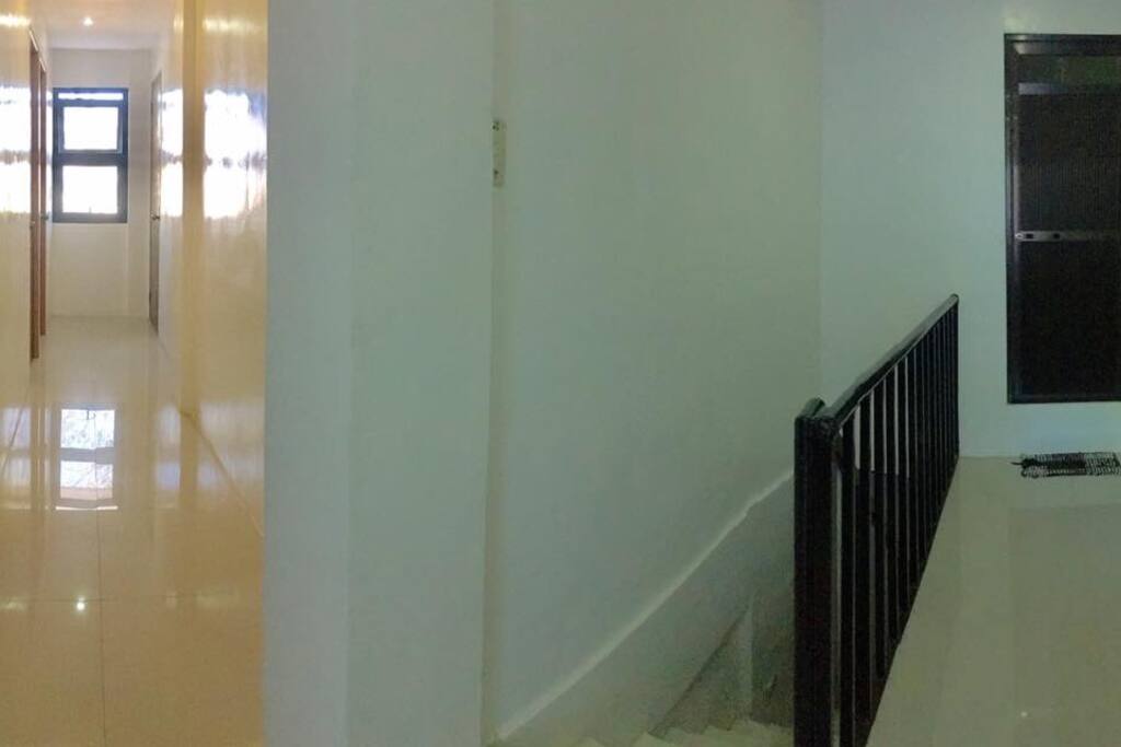 Hallway going to 3 bedrooms.