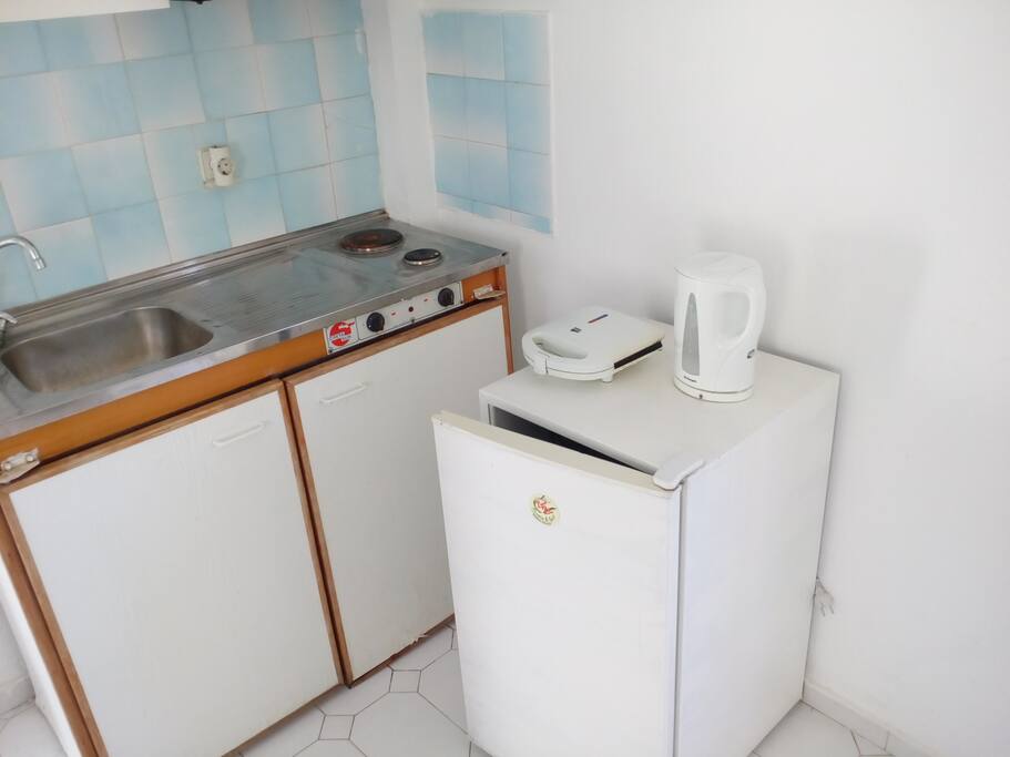 the kitchen with the fridge ,a toaster and a water boiler for you coffee tea or a soup