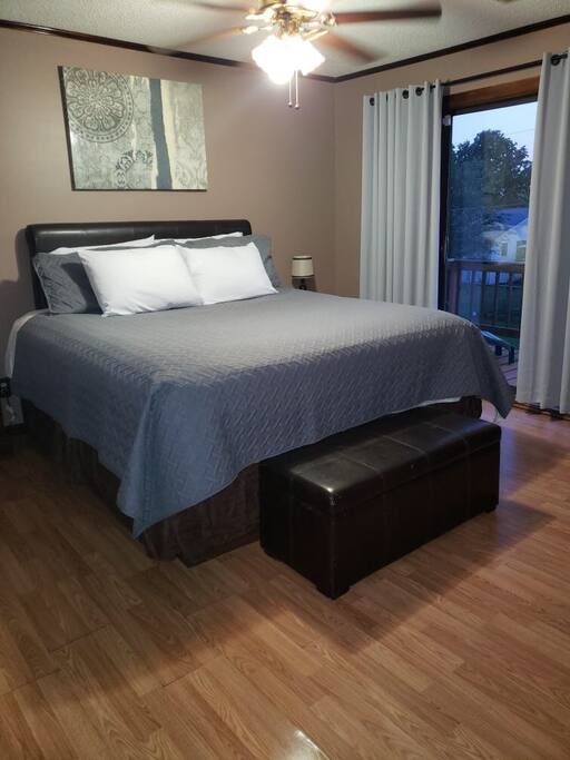Please see the sliding glass doors as an additional private entrance. Not shown is the private bathroom. Door leads to deck and back yard. Since picture taken, new bed frame.