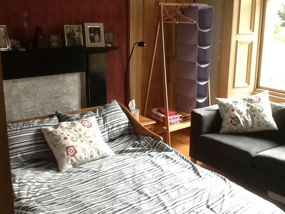 Sitting room set up as a bedroom with sofa bed & folding wardrobe & still plenty of space to sit!