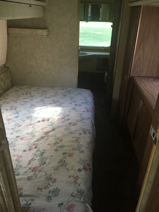 Double bed in middle of Airstream trailer