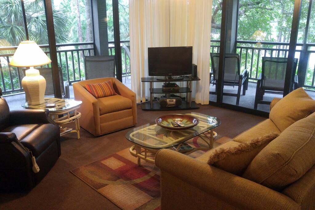 Family room with direct access to screened lanai on 2 sides.