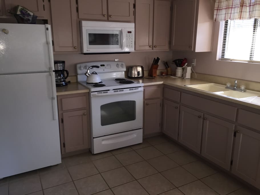 Kitchen has microwave, coffee maker, pots, pans and dishes. Regular and decaf coffee provided along with tea bags.