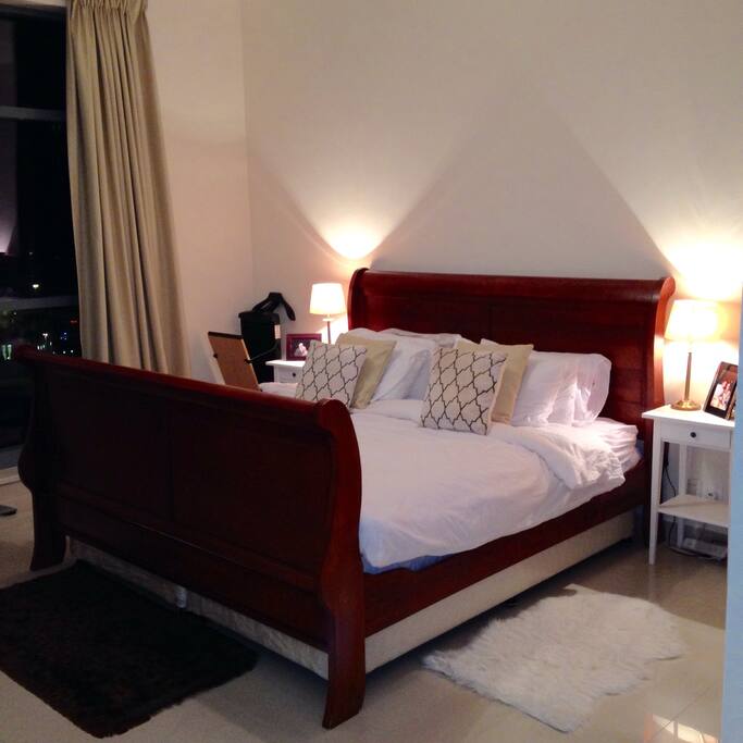 Large Master Bedroom with California King Size mahogany sleigh bed and en-suite bathroom