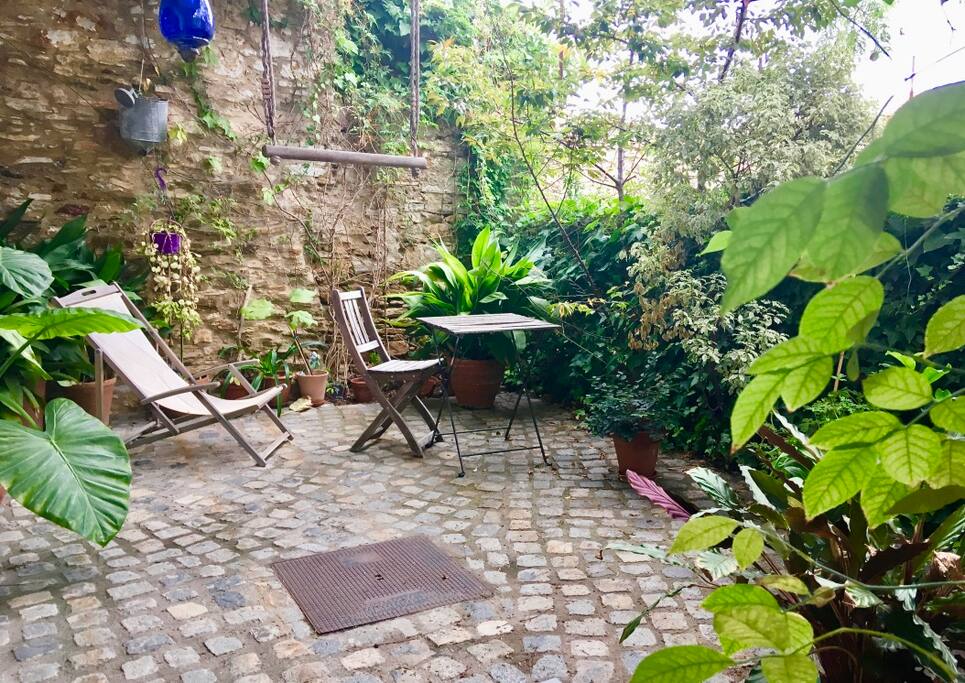 patio...coziness and charm to enjoy your holiday book surrounded by loved plants
