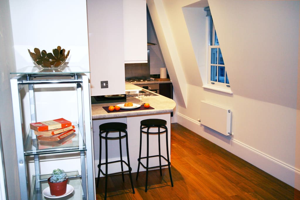 Enjoy a snack at our breakfast bar, in our super top floor studio flat