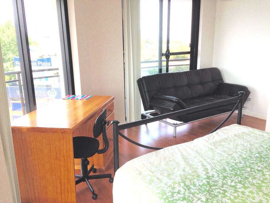 Bright room with sofa and desk