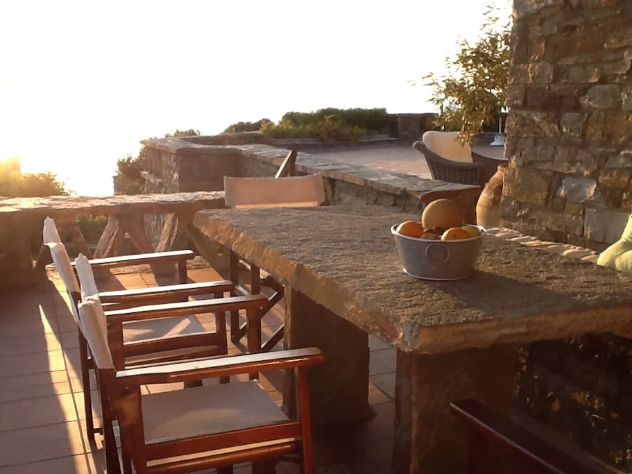 Stone-built dining table just outside the kitchen.