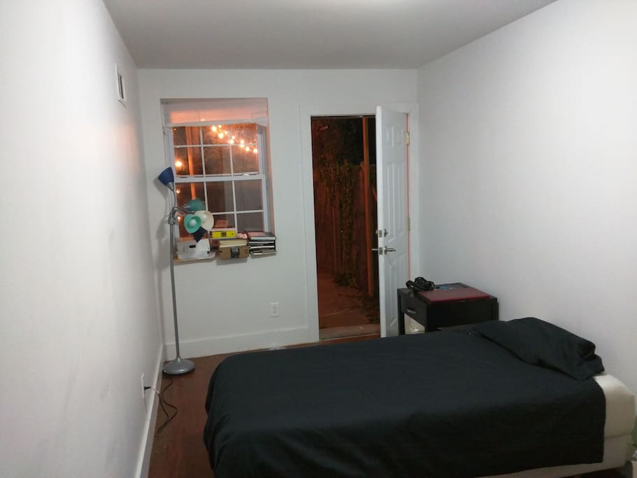 Memory foam mattress, with night stand , a closet , a drawer, floor lamp and direct access to backyard.