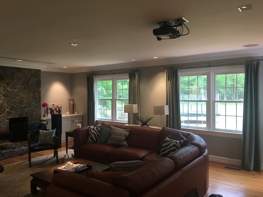 Living Room/Theatre Room with drop-down screen and projector