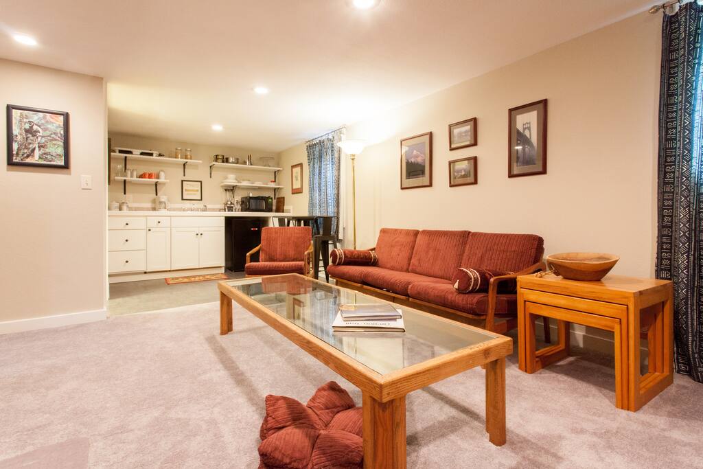 Retro couch and easy chair let you put your feet up after a day of exploring Portland.