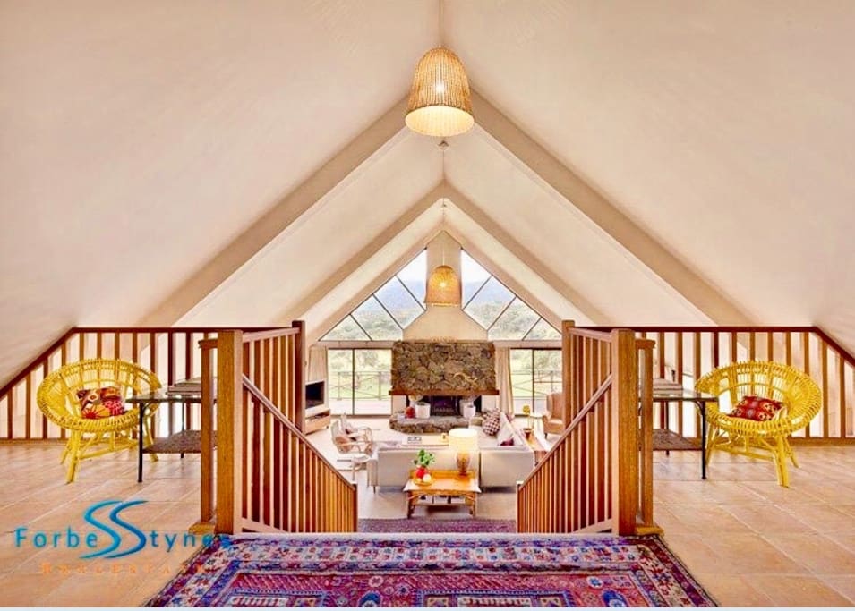 Top level entrance (2 bedrooms) stairs to open plan living, dining, lower bedrooms, deck, panoramic views.