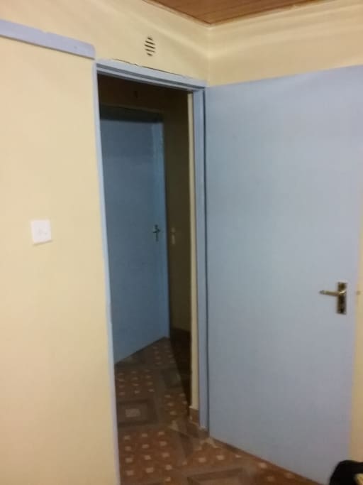 The door way to corridor of the rooms, Bathroom, toilet and kitchen