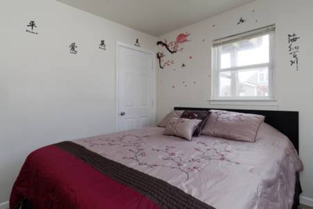 Queen sized bed and Personal Bed Table with IKEA drawer end table.