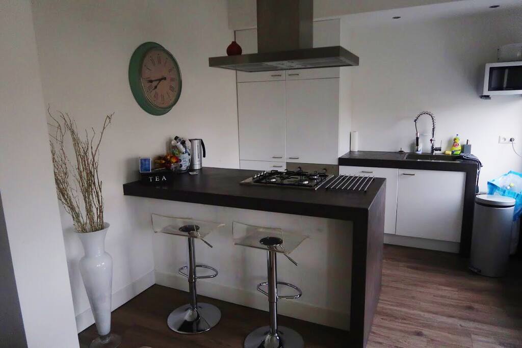 Kitchen with oven and microwave