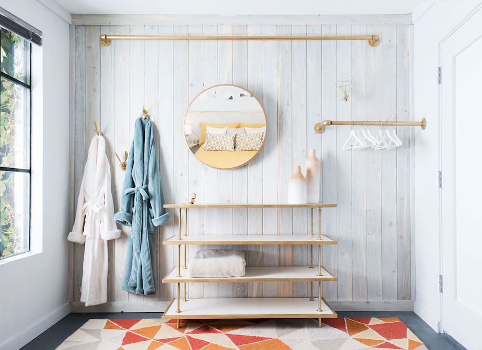 You will rest well in this peaceful retreat. The exposed closet and vertical wood wall make this bedroom feel tall, with plenty of space to keep all of your things.