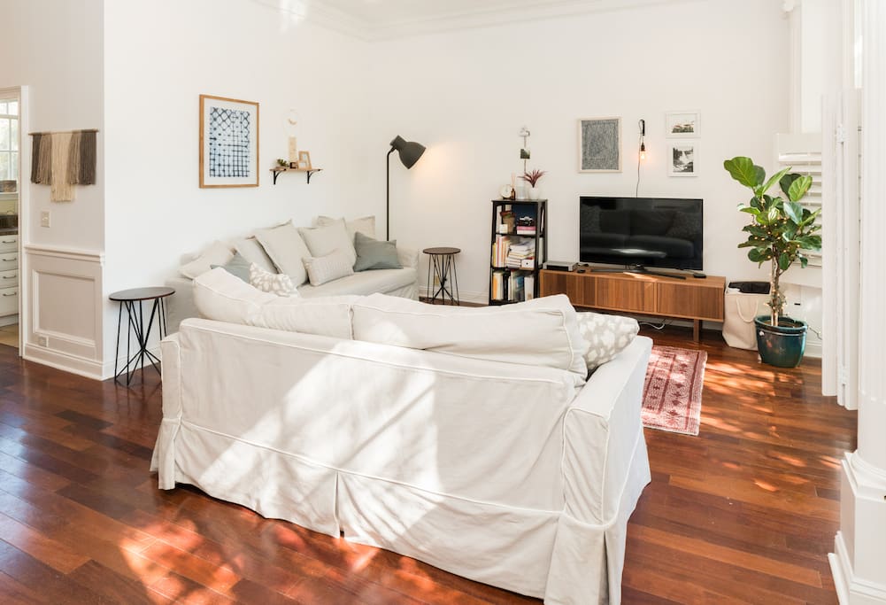 The living room is equipped with a smart TV and cable.