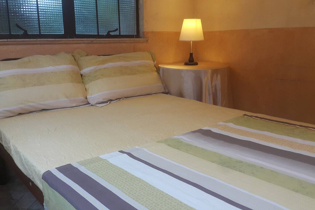DOUBLE BED, AIR CONDITIONED, CABLE TV IN 2 BEDROOM GUEST HOUSE WITH KITCHEN, SALA, & DINING TERRACE