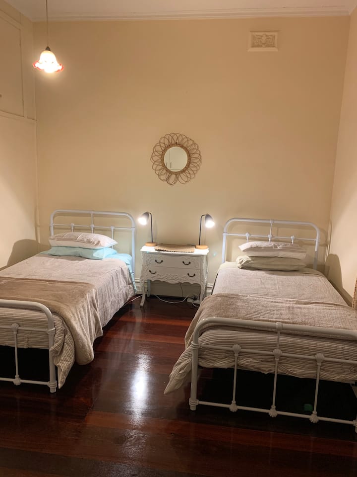 Bedroom 4, 2 king single beds, ample wardrobe space and comfortable chair
