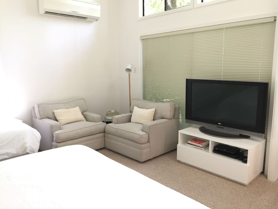 Small sitting area and television with basic cable and DVD player.