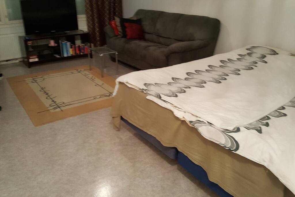 A 200cm x 180cm large bed and a cozy 3-sitter soffa.