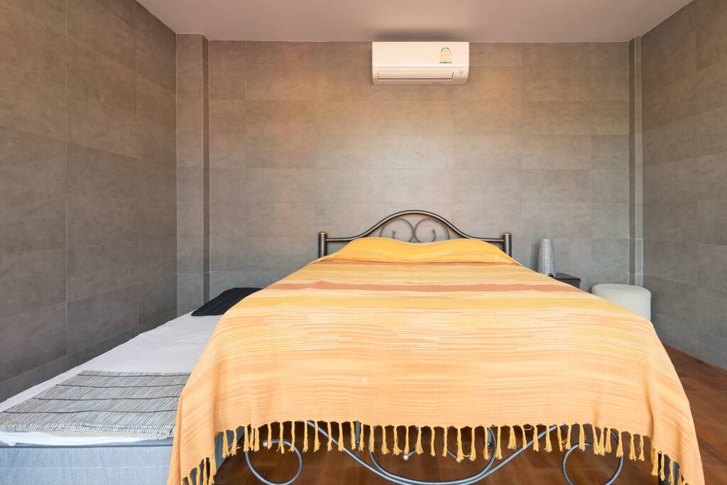 A queen sized bed and with an extra bed if requested.