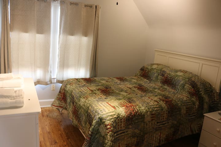 This is a queen bedroom upstairs, 1 of three total bedrooms.